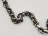 a large metal chain that has a heart on it