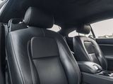 the interior of a car with black leather seats and a center console
