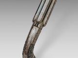 an old gun with a wooden handle on a gray background