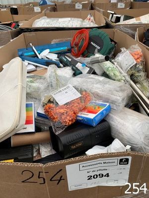 a cardboard box filled with assorted items in a warehouse
