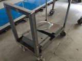 a machine that is working on a table in a factory