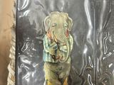 a small elephant statue on top of a plastic bag