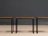 three small wooden stools with metal legs and a wooden top
