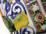 a close up of a purse with a floral design on it