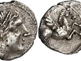 a silver coin with an image of a horse and a bird on it