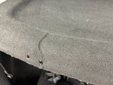 a close up of a piece of cloth with holes in it