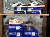 many boxes of shoes sitting on a shelf in a store
