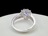a picture of a diamond engagement ring on a white plate