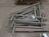 many pieces of metal on the floor next to a pallet