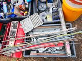 a box full of assorted items sitting on the ground