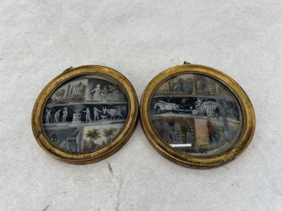 pair of antique gold plated picture frames with horses and carriages on them