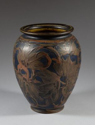 a vase that is sitting on a white surface