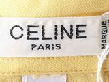 the label of a yellow shirt with a name on it