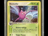 a close up of a pokemon card in a plastic case