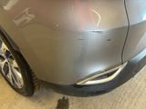 a close up of a car that has a denting on it