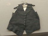 a black vest with a white shirt on a hanger