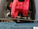 a red fire hydrant sitting in a box on the floor