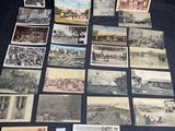 several old postcards of different types and sizes on a table