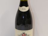 a bottle of wine that is sitting on a table