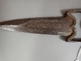 a knife that is laying on a table