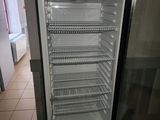 an image of a refrigerator in a kitchen with the door open