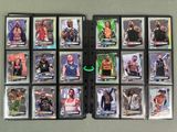 a close up of a bunch of wrestling cards on a table