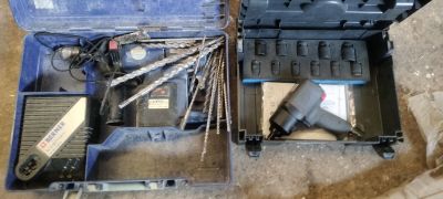 a tool box with a drill and a drillet inside of it