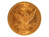 l'image d'une pièce d'or ornée d'un aigle