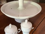 a three tiered cake stand on a wooden table