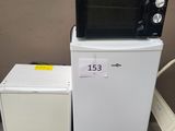 a microwave sitting on top of a cart next to a refrigerator