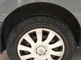 a close up of a car ' s tire on the ground
