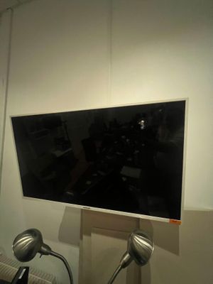 a television mounted on a wall in a room