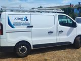 a white van that is parked in the grass