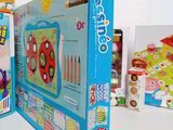 a box that has a toy on top of it next to other toys