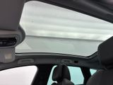 a view of the sunroof from inside of a car