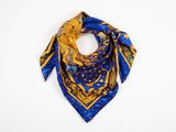 a blue and yellow square scarf with a gold dragon on it