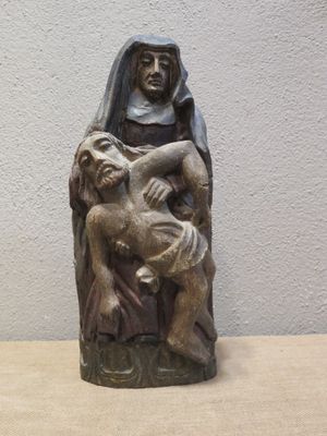 statue of a woman holding a child on her lap
