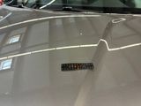 a car that has a sticker on the hood of it