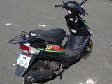 a scooter that is parked in a parking lot