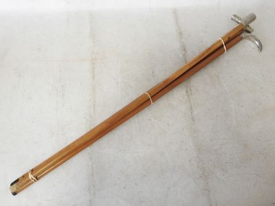 a pair of wooden chopsticks sitting on top of a white surface