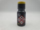 a close up of a bottle of black ink on a white surface