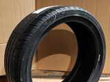 tire on the ground next to a cardboard box and cardboard boxes