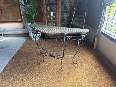 a table with a basket on top of it in a room
