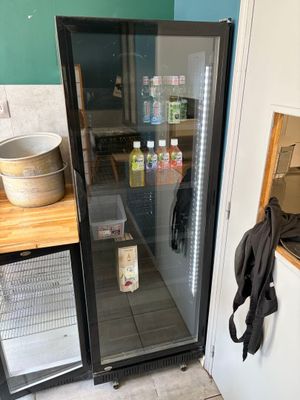 a refrigerator that is sitting in a kitchen next to a counter