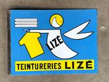 a blue sign with a picture of a person holding a toothbrush