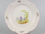 a plate with a picture of a man and a woman on it