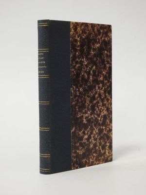 a close up of a book on a white surface with a white background