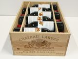 six bottles of wine in a wooden box