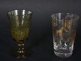 two wine glasses sitting next to each other on a table