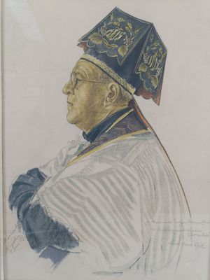 portrait of a man wearing a blue hat and a white shirt